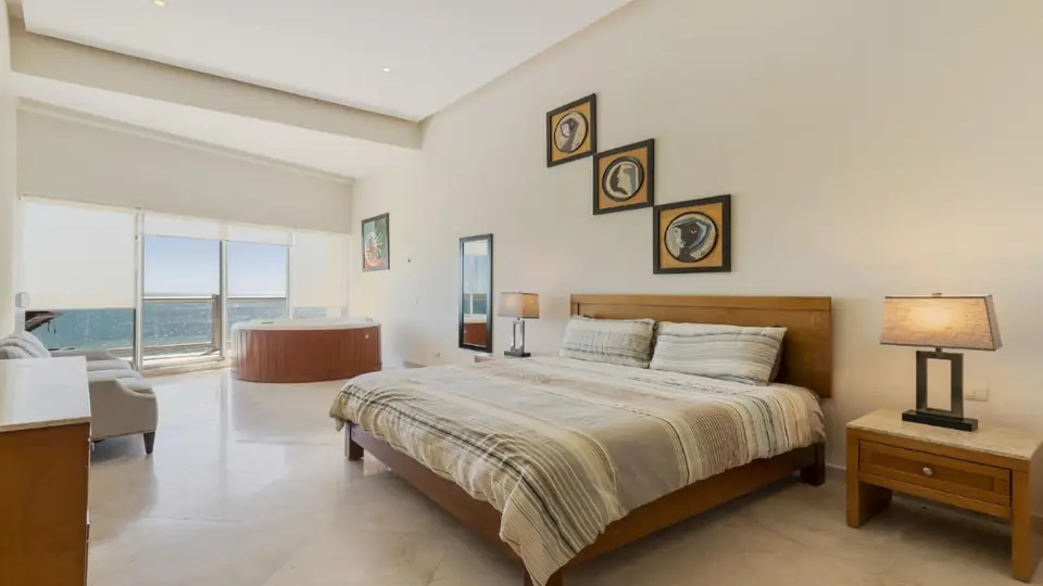 Penthouse Apartment at Luna Blanca & Encanto Living, master bedroom with an ocean view